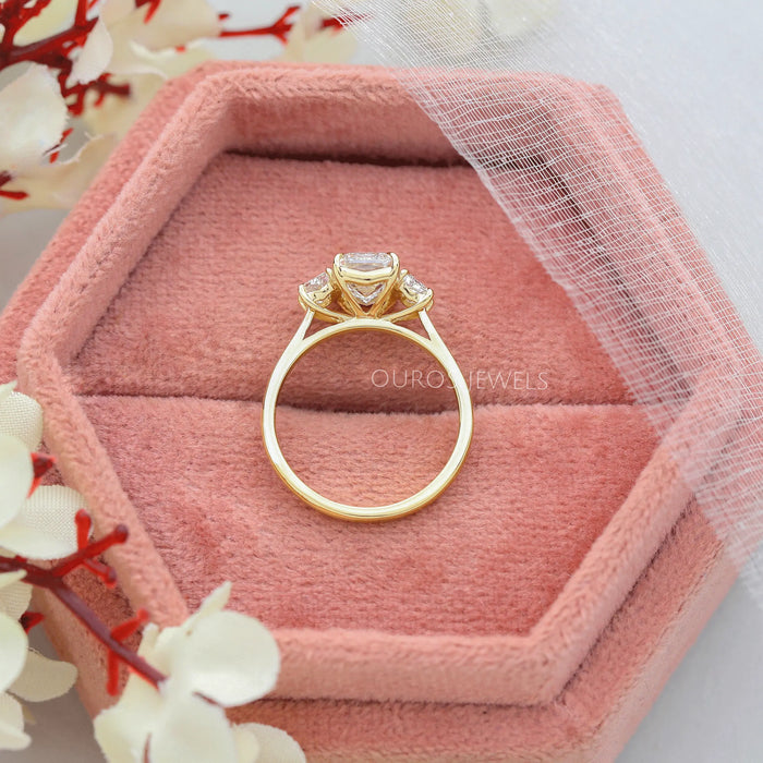 3 stone diamond ring inside the soft ring box 