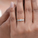round and shield cut lab diamond five stone engagement ring on model's finger