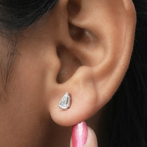 Arrow Cut Stud Diamond Earrings displayed on an ear, highlighting the elegant arrow-shaped diamond and sophisticated stud.