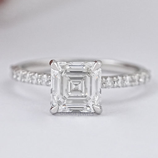front view of asscher cut diamond solitaire accent engagement ring on grey fabric