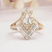 front view of baguette and round-cut lab diamond chevron wedding band on fabric