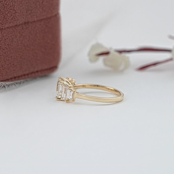 side view of asscher and baguette cut lab diamond five stone engagement ring