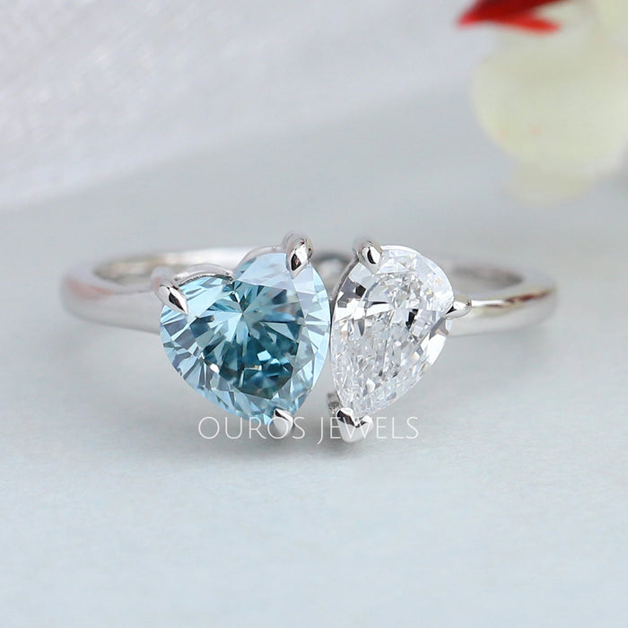 front view of blue heart and pear-cut lab diamond toi et moi wedding ring