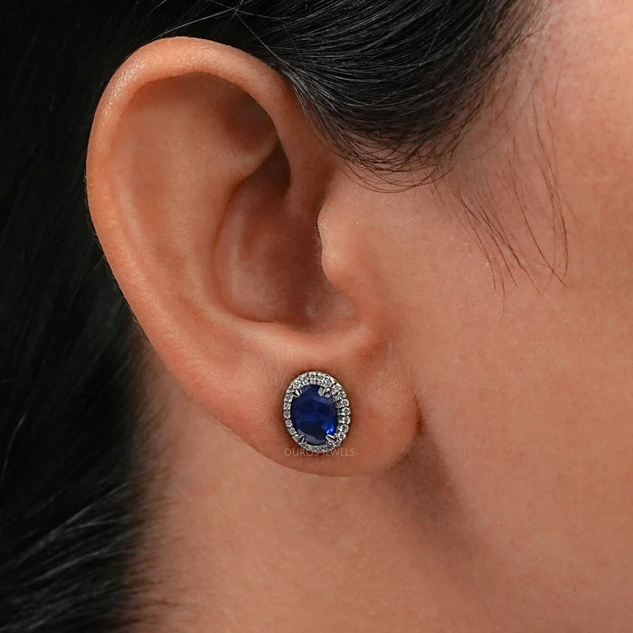 blue oval halo gemstone studs