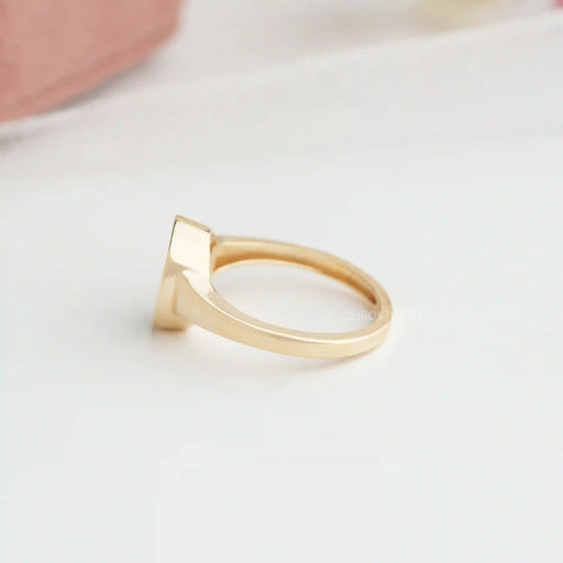 side view of cat face lab diamond bezel set engagement ring