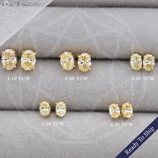 front view of yellow oval cut lab grown diamond screw back earrings gold