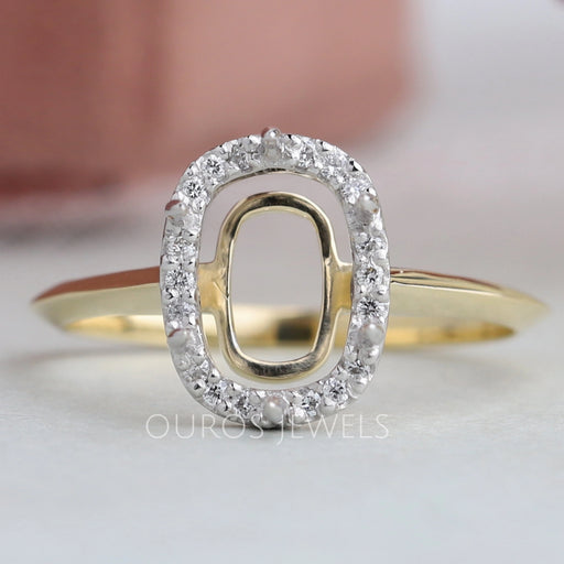 front view of cushion-cut semi-mount halo engagement ring with yellow gold band