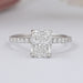 front view of cushion-cut lab diamond solitaire accent wedding ring on grey fabric