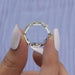 close view of round cut lab made white gold diamond ring with chain link