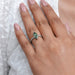 green marquise-cut lab diamond solitaire accent wedding ring on model's finger