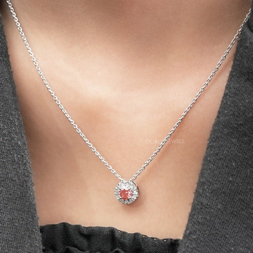 round pink lab created diamond prong setting halo pendant necklace on neck