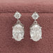 front view of round and oval cut lab grown diamond drop dangle earrings