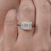top view of east west emerald cut lab diamond bezel set engagement ring