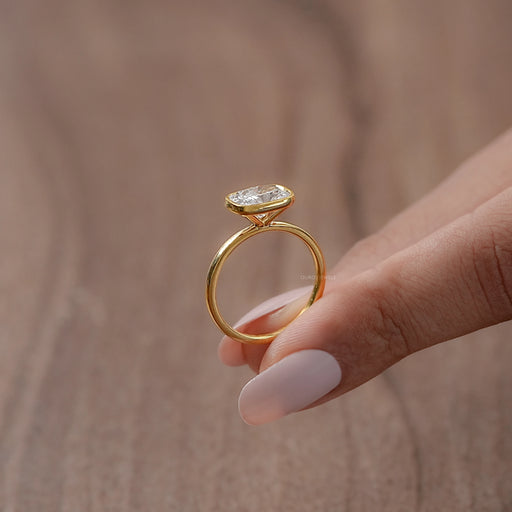 bezel set east west cushion cut diamond engagement ring side angle look