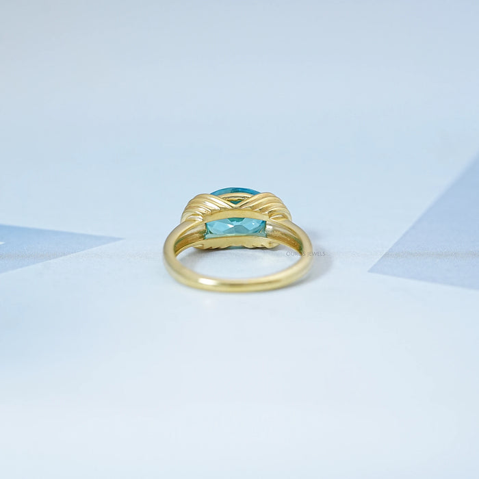back view of east west blue oval cut gemstone wedding ring
