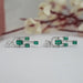 emerald and diamond linear drop earrings
