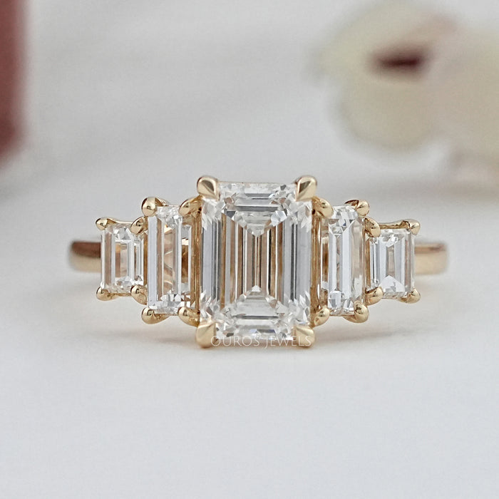 front view of emerald and baguette cut lab diamond five stone engagement ring