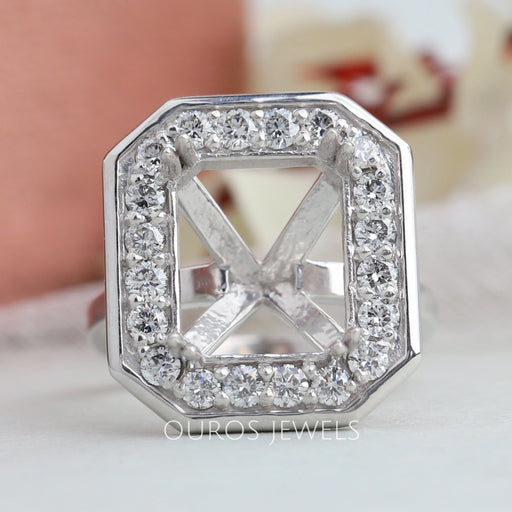 front view of emerald cut round diamond halo semi-mount engagement ring