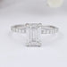 front view of igi certified emerald cut diamond solitaire accent ring on grey fabric