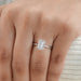 emerald cut lab diamond solitaire engagement ring in finger