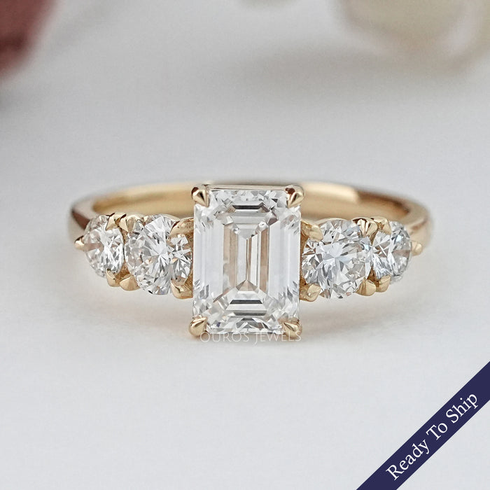 front view of emerald cut and round lab diamond five stone engagement ring