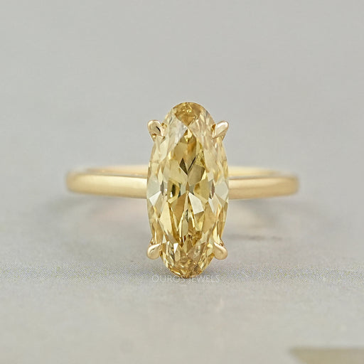 front view of old mine moval cut yellow diamond engagement ring