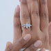 marquise cut diamond five stone engagement ring with white gold band in finger