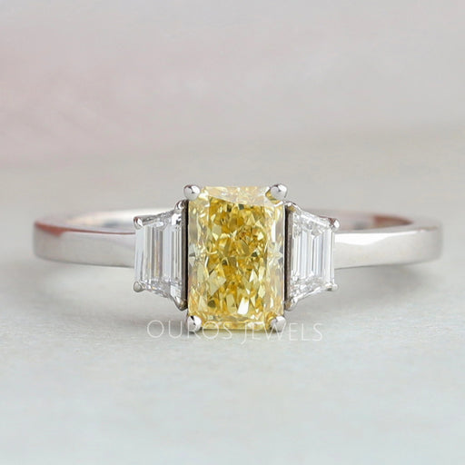 front view of yellow radiant cut lab diamond three stone engagement ring