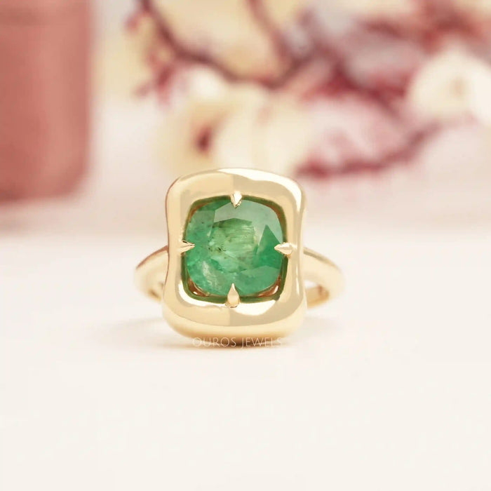front view of green emerals cushon cut solitaire ring 