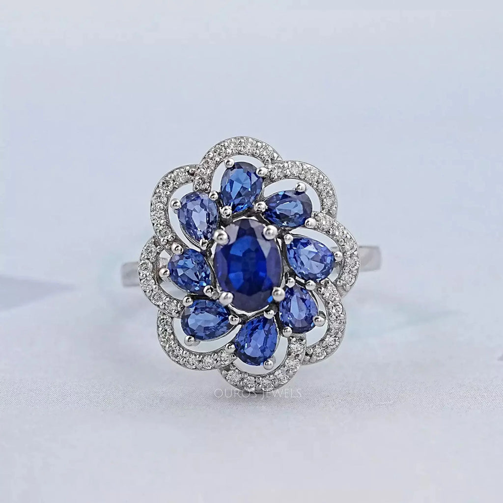 blue sapphire oval diamond floral halo engagement ring's front view