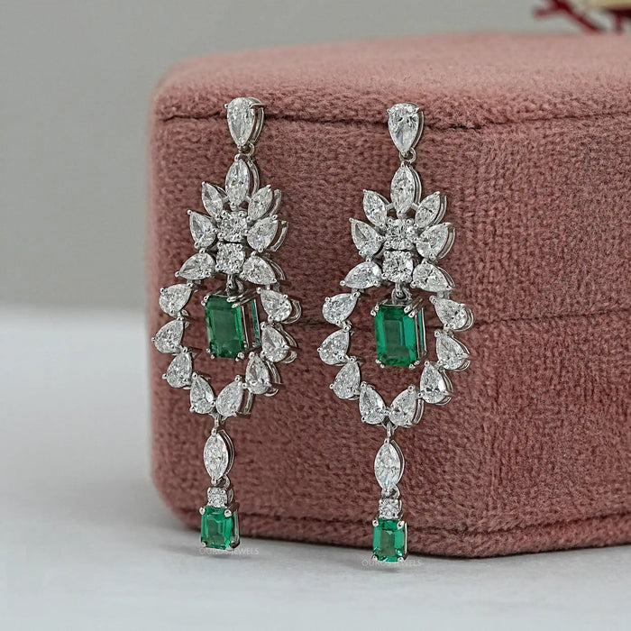 green emerlad dagle earrings iwth sparkling diamonds