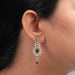 green emerald dangle earring weared by women 