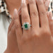 green emerald halo ring with multi shape diamonds 