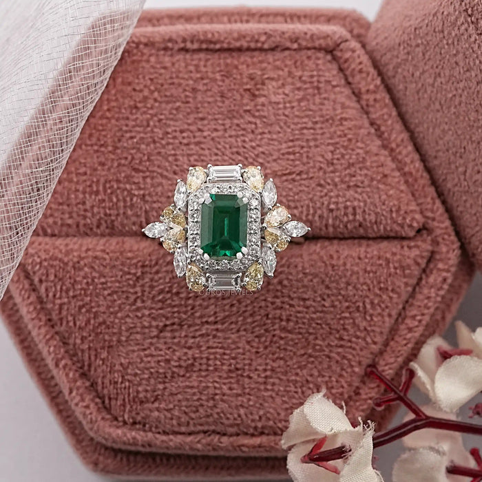 emerald gemstone and cluster diamond ring 