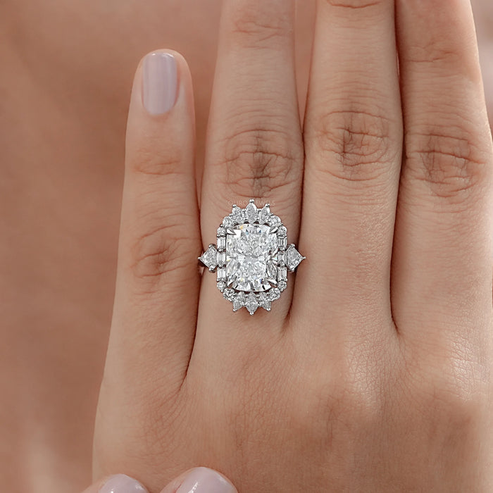 elongated cushion diamond with baguette and round halo wedding ring in finger