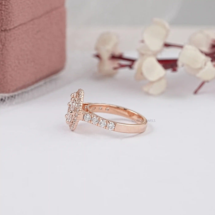 floral style round diamond with halo accent ring