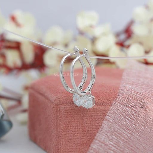 side view of step cut hexagon cut diamond 4 prong dangle drop earrings white gold