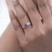 pink square cushion cut lab diamond five stone engagement ring on model's finger