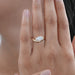 marquise cut lab diamond wave engagement ring in yellow gold in finger