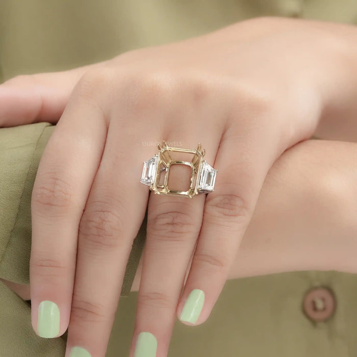 step-cut trapezoid semi-mount three-stone wedding ring on model's finger