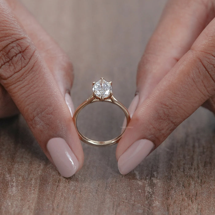 close up view of six prong marquise cut lab diamond engagement ring