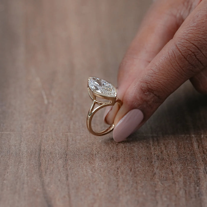 side view marquise diamond half bezel set engagement ring with split shank band