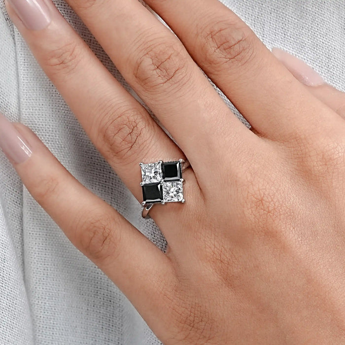 princess-cut black lab diamond solitaire anniversary ring on the model's finger