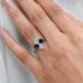 princess-cut black lab diamond solitaire anniversary ring on the model's finger