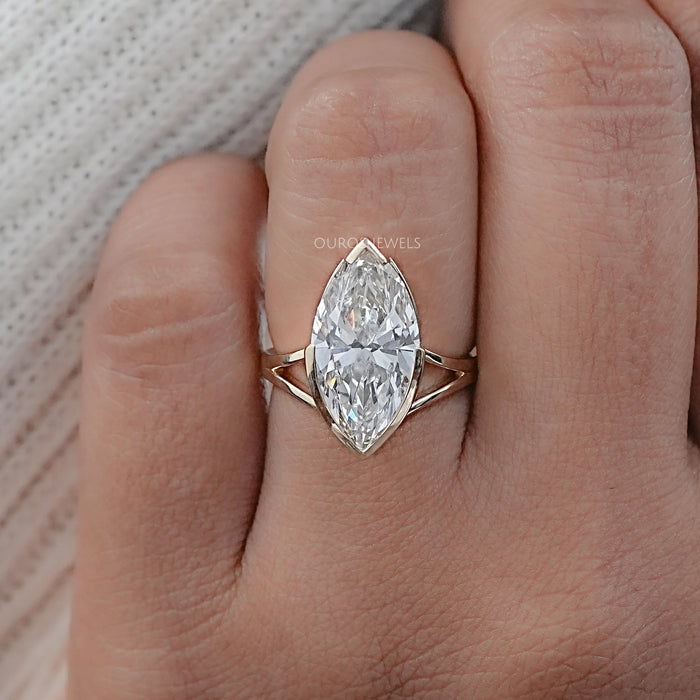 front view marquise diamond half bezel set split shank wedding ring on finger