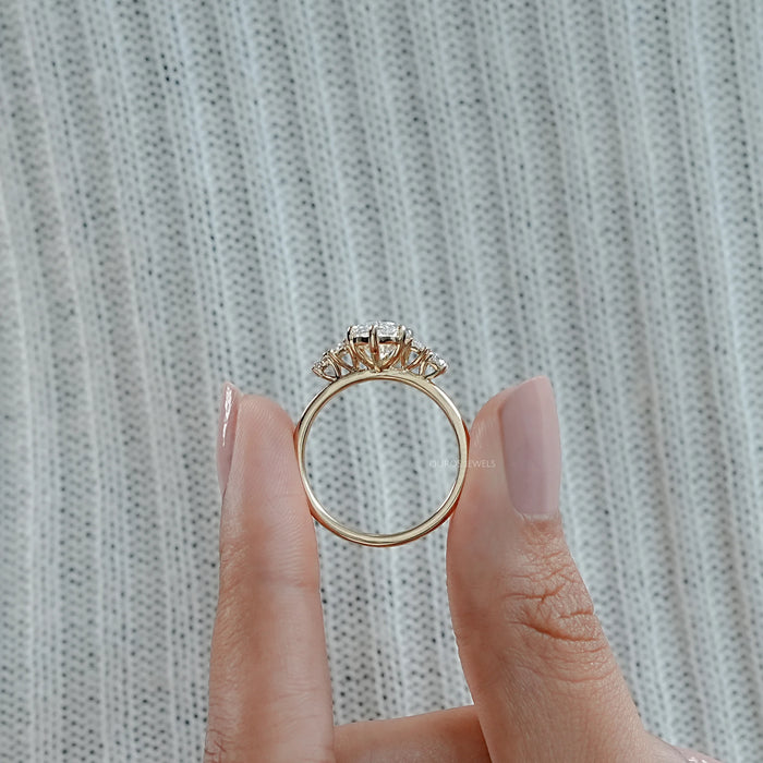 close view of marquise and baguette cut diamond five stone engagement ring