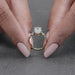 close view of moval cut lab diamond solitaire accent engagement ring