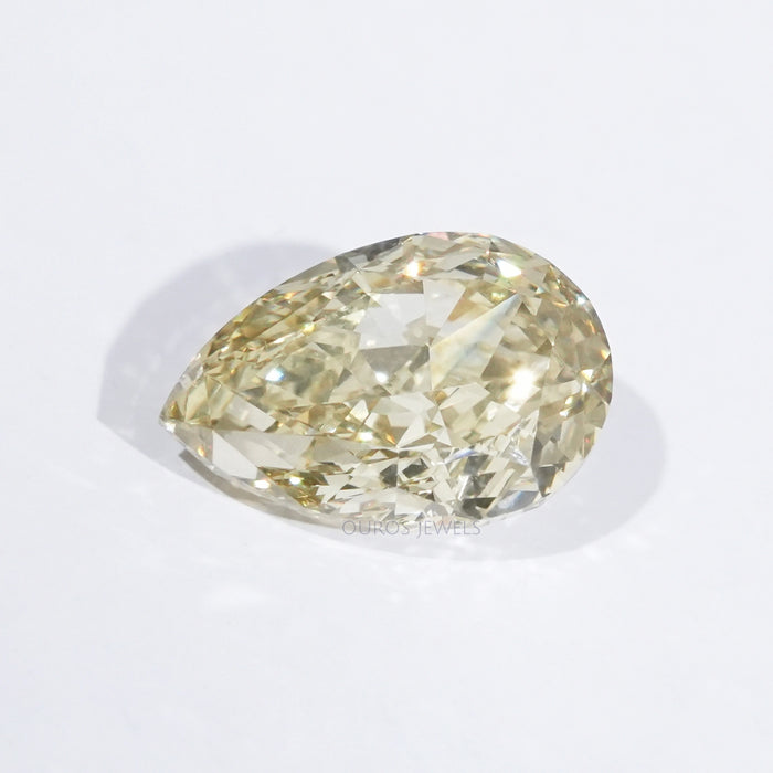 front view of modified yellow pear shaped lab grown diamond loose