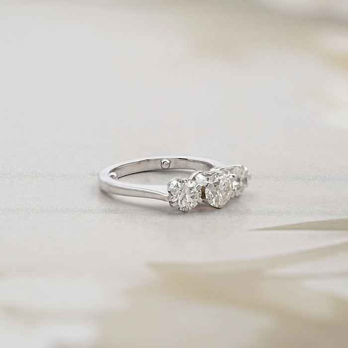 side view of old european round cut lab diamond three stone engagement ring