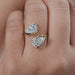 front view of pear-cut lab-grown diamond toi et moi engagement ring in finger